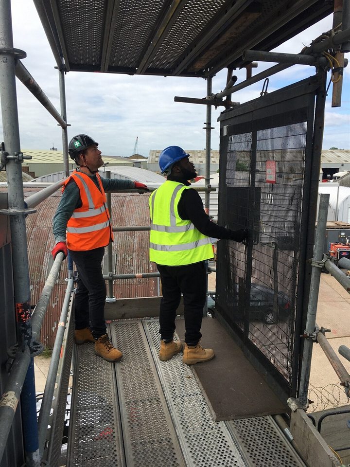 Hoist operator undertaking practical site familiarisation at a construction hoist landing